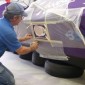 Shane preparing Sedna for retouching after repairing the hole in her hull